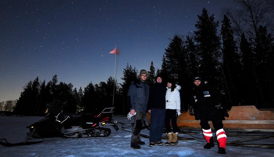 Luleå : Northern Lights Tour on a Snowmobile drawn Sled - Riding in a sled lined with reindeer pelts