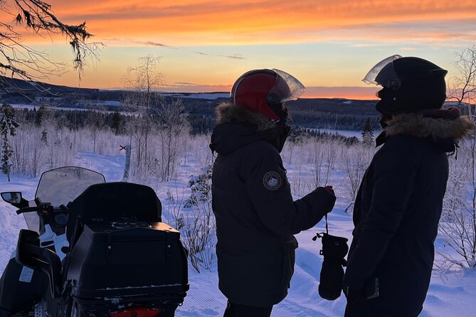 Private snowmobile day tours - A lakeside lunch beside the fire