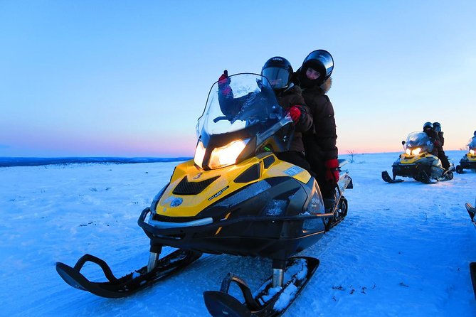 Snowmobile Safari to Lapland viewpoint - Coffee, fire, and ice fishing on a frozen lake